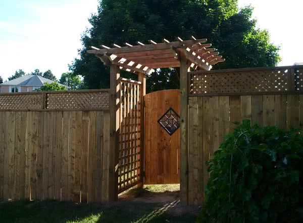 Wood fence with pergola arbour in Cambridge by Campbell Fence 